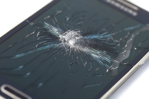 A close-up of a cracked smartphone screen with distorted financial data, symbolizing the risk of cyber threats and the need for digital insurance coverage.
