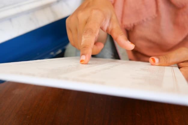 A close-up shot of a hand signing a document related to student loan recertification, with a form displaying income and family size information.