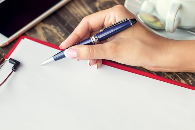 A close-up image of a hand holding a pen, signing a document labeled 