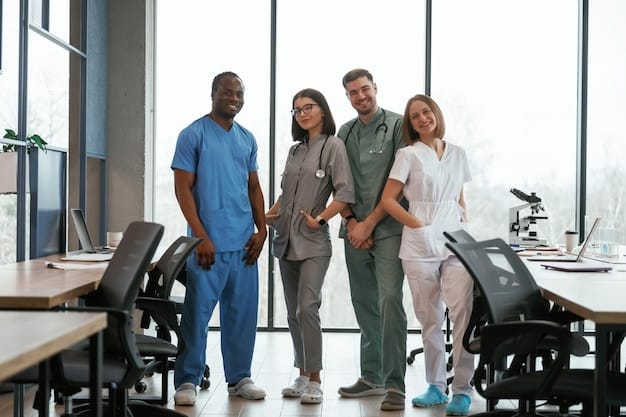 A diverse group of healthcare professionals (doctors, nurses, and technicians) standing together in a hospital hallway, smiling and looking confident.
