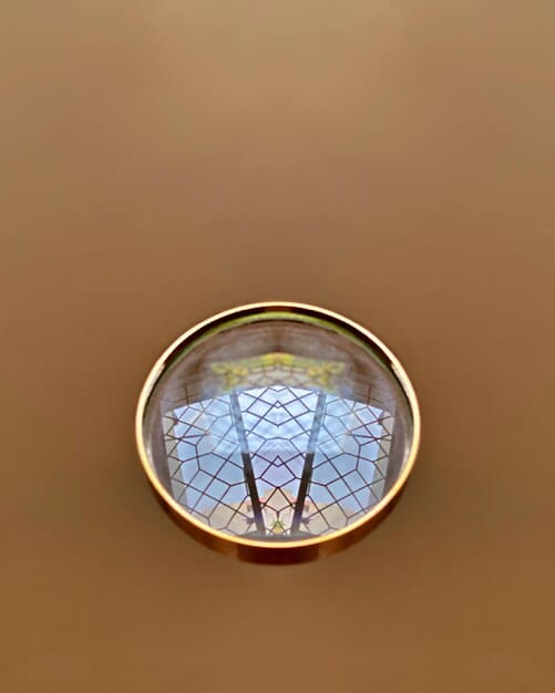 A collage of accreditation logos (e.g., regional, national) with a magnifying glass hovering over them. The image emphasizes the importance of verifying accreditation status.