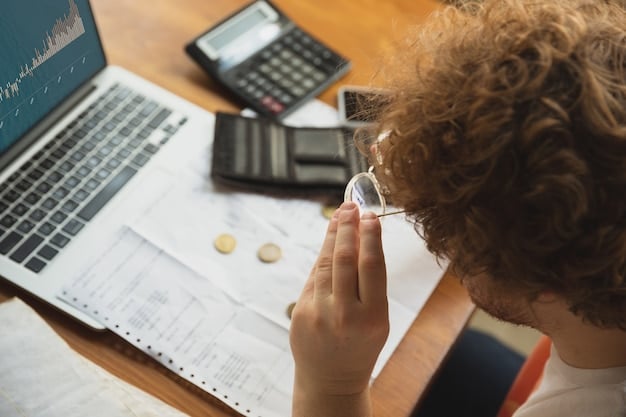 A close-up of a person using a calculator and looking at a depreciation schedule, highlighting the numerical aspect of calculating deductions.