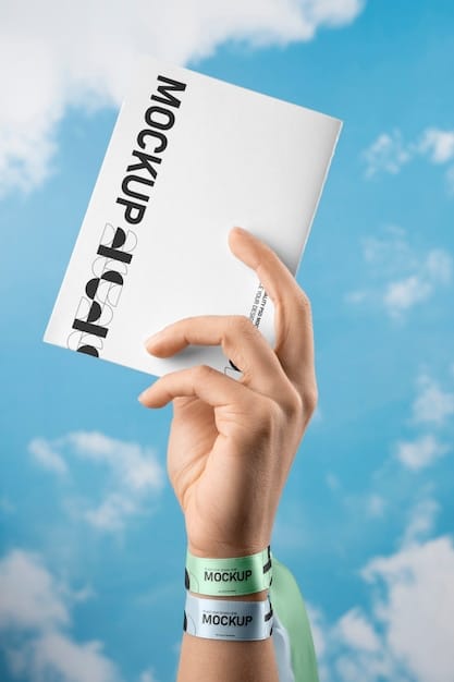 A close-up of a hand reaching for a scholarship flyer with the word 