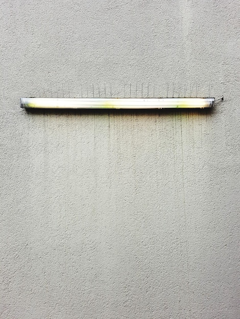 A cross-section of a wall showing properly installed insulation, highlighting its thickness and the air barrier. Labels indicate the R-value and demonstrate how insulation reduces heat transfer.